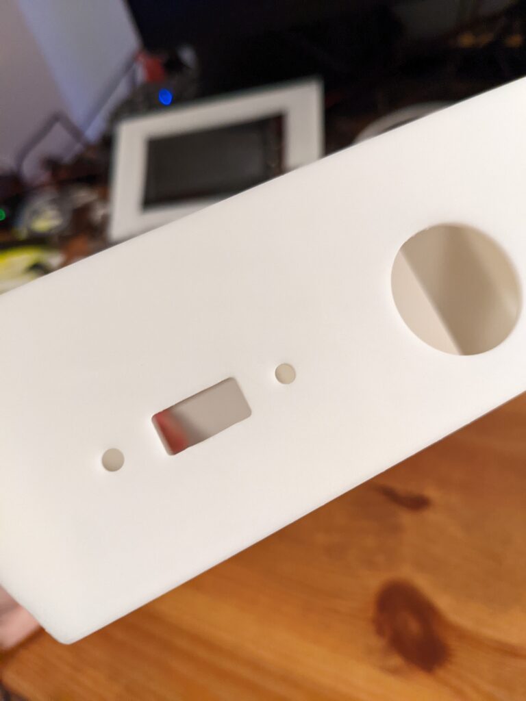 The side of the case body, with holes for mounting USB ports