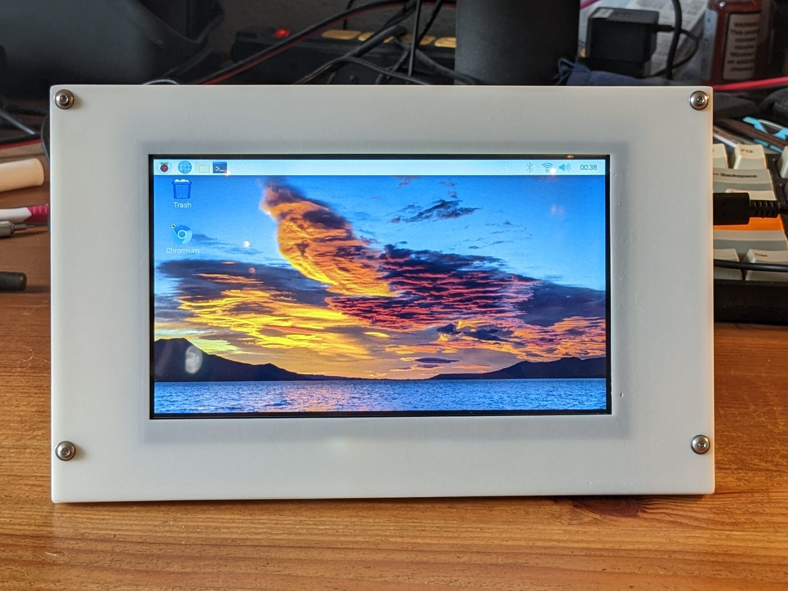 A Debian LXDE desktop live on the LCD screen in the sealed case