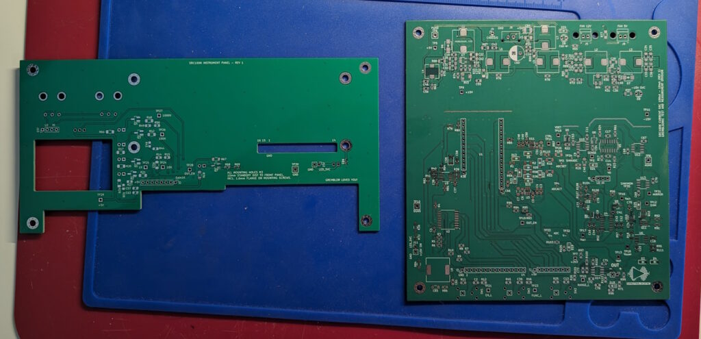 Two PCBs sit on top of a placemat
